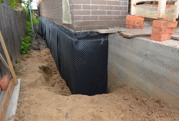 Happy homeowners after waterproofing job in Port Tobacco
